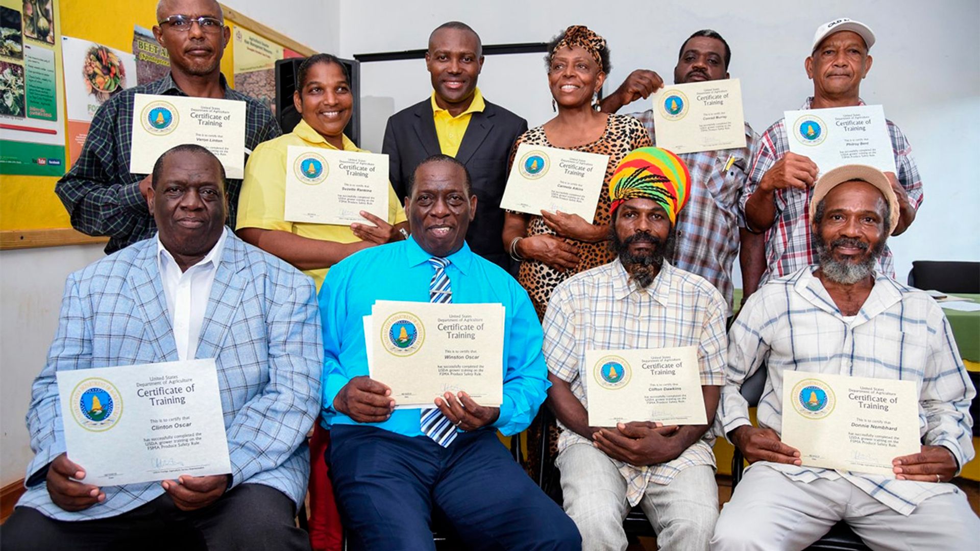 Image of participants holding certificates of completion following a workshop