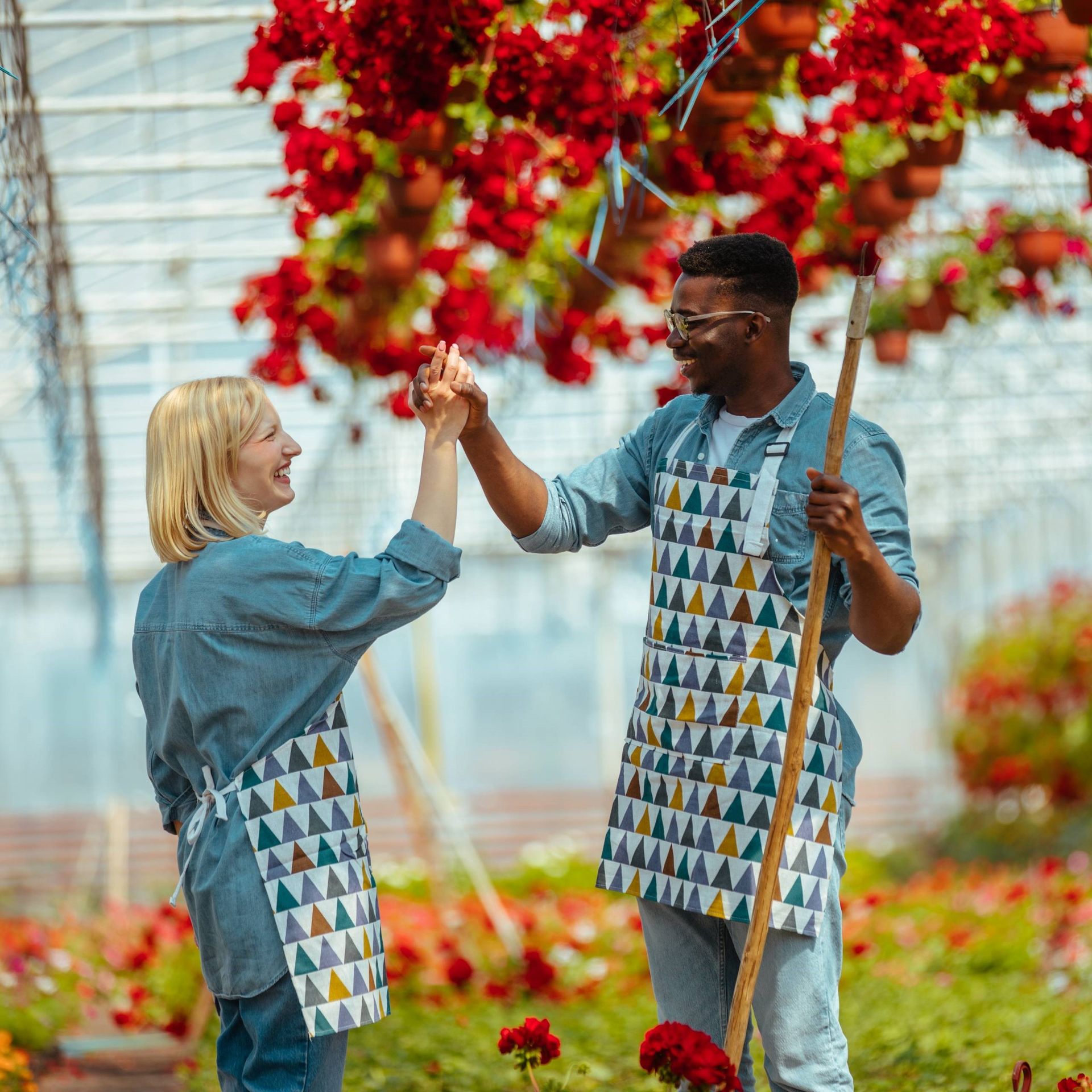 Image of two agricultural workers in a greenhouse