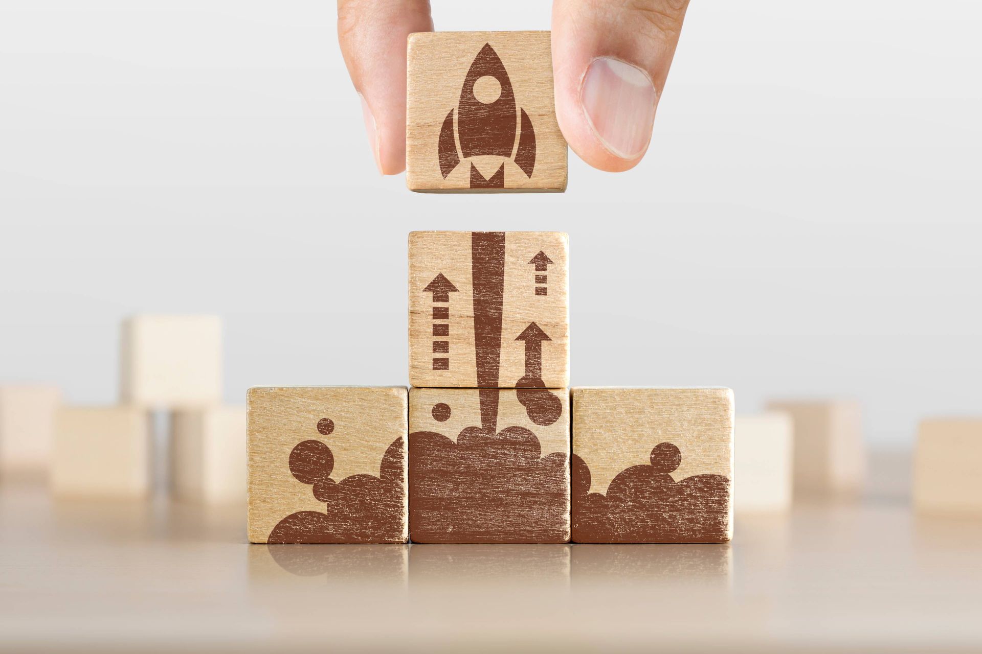 Image of wooden blocks with a rocket design assembled to represent a product launch